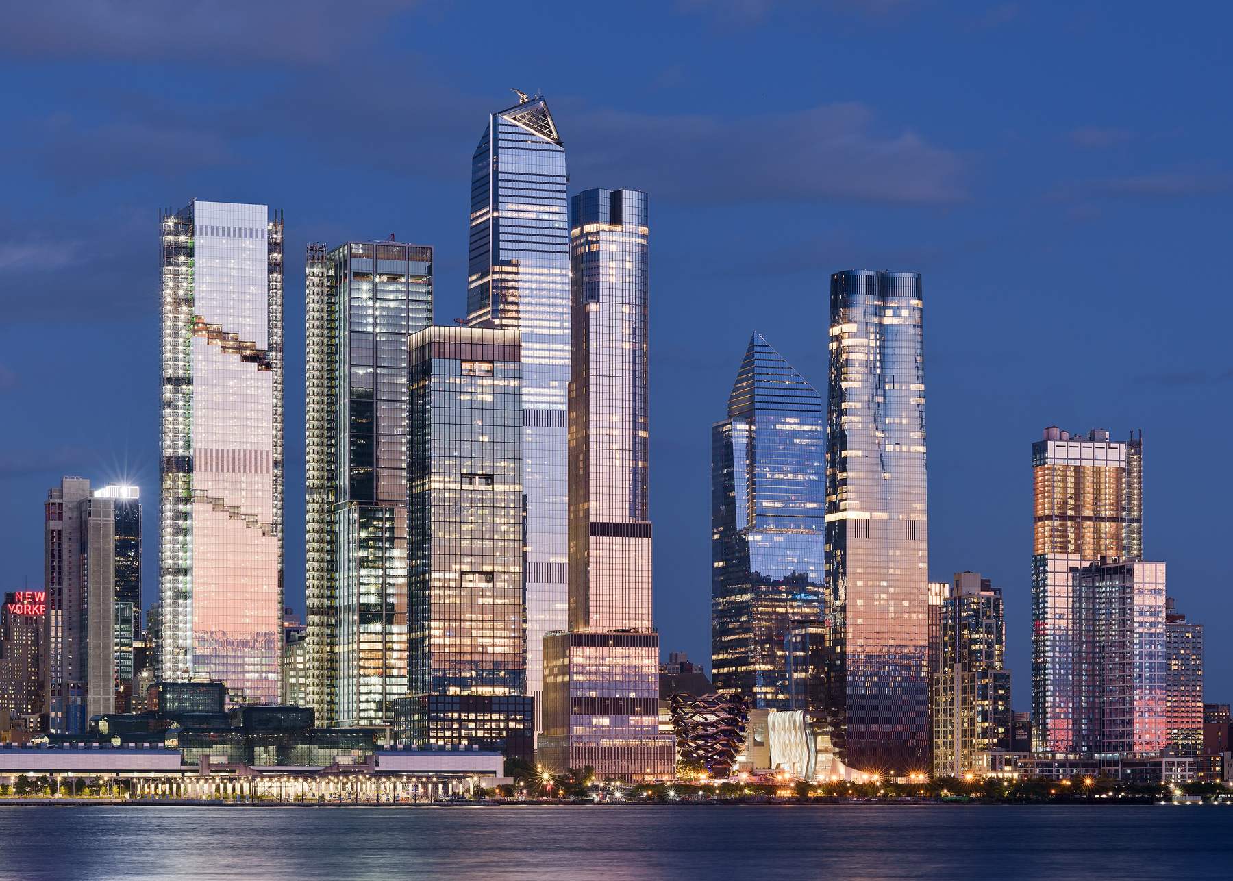 Glass towers of Hudson Yards in Midtown Manhattan at blue hour, seen across the Hudson River from Weehawken